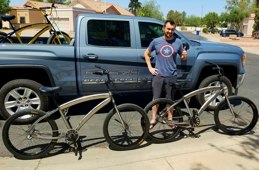 A man next to bikes and a pickup