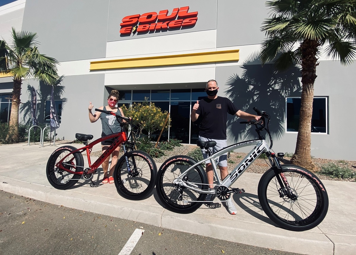 Two happy people with their new bikes